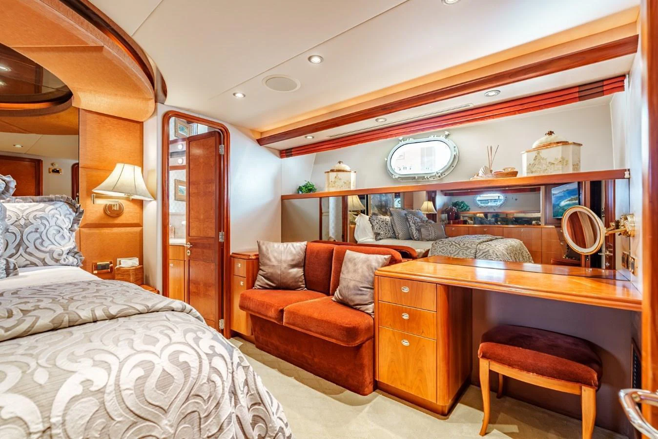 The image showcases a luxurious stateroom with elegant decor and comfortable furnishings. aboard SNOWBORED Yacht for Sale