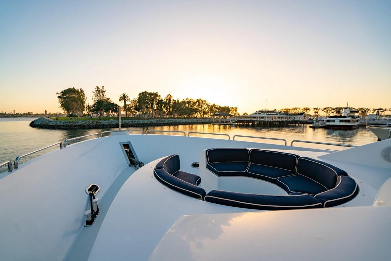 The yacht's bow features a luxurious circular seating area, perfect for enjoying serene waterfront views. aboard SNOWBORED Yacht for Sale