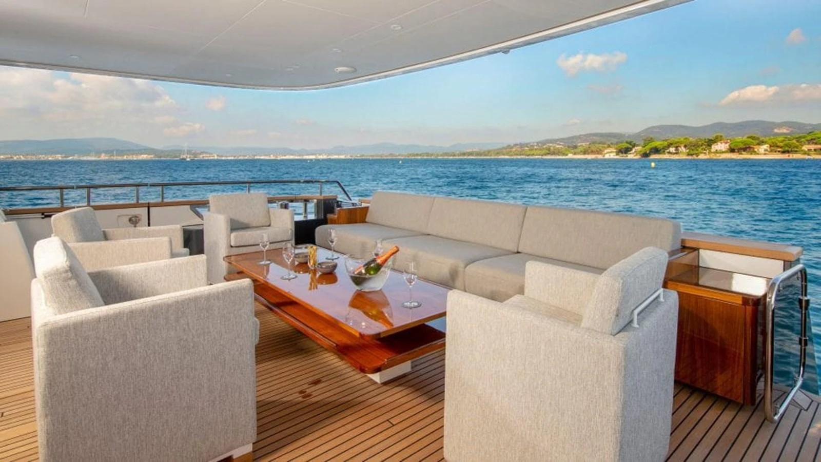The aft deck features a spacious and elegant seating area with a stunning ocean view. aboard JANGADA Yacht for Sale