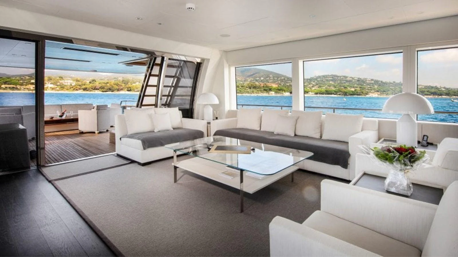 The salon offers a spacious and elegant area with panoramic views and luxurious seating. aboard JANGADA Yacht for Sale