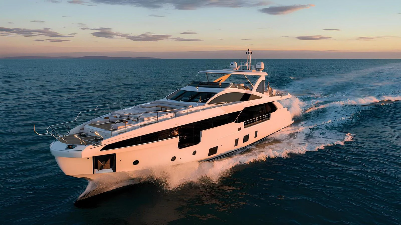 A sleek and modern yacht cruises through the open sea at sunset. aboard G Yacht for Sale