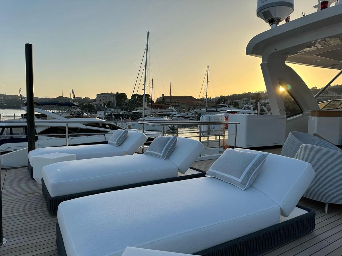 The sundeck offers luxurious loungers with a picturesque marina view at sunset. aboard G Yacht for Sale