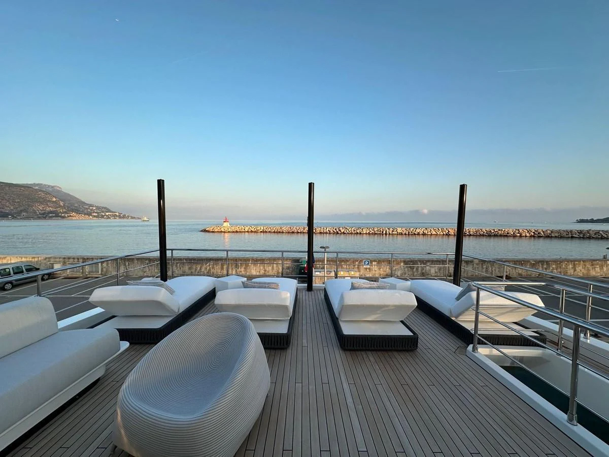 The sundeck features luxurious sun loungers with a stunning view of the sea and coastline. aboard G Yacht for Sale
