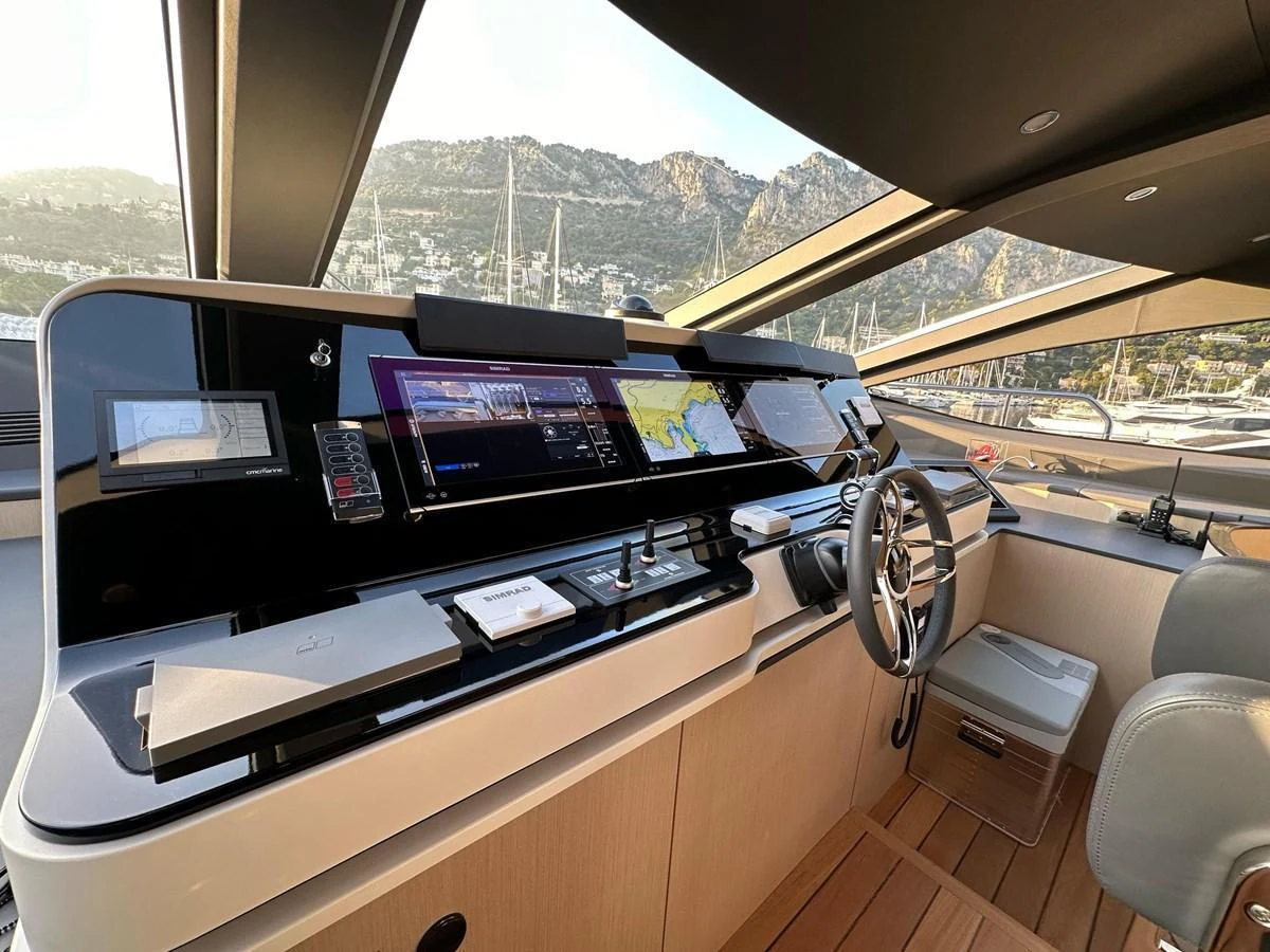 The helm station features state-of-the-art navigation equipment and luxurious finishes, offering a commanding view of the surroundings. aboard G Yacht for Sale