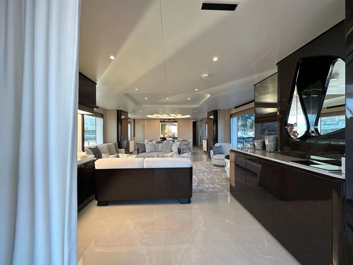 The luxurious salon features elegant seating and modern decor with ample natural light. aboard G Yacht for Sale