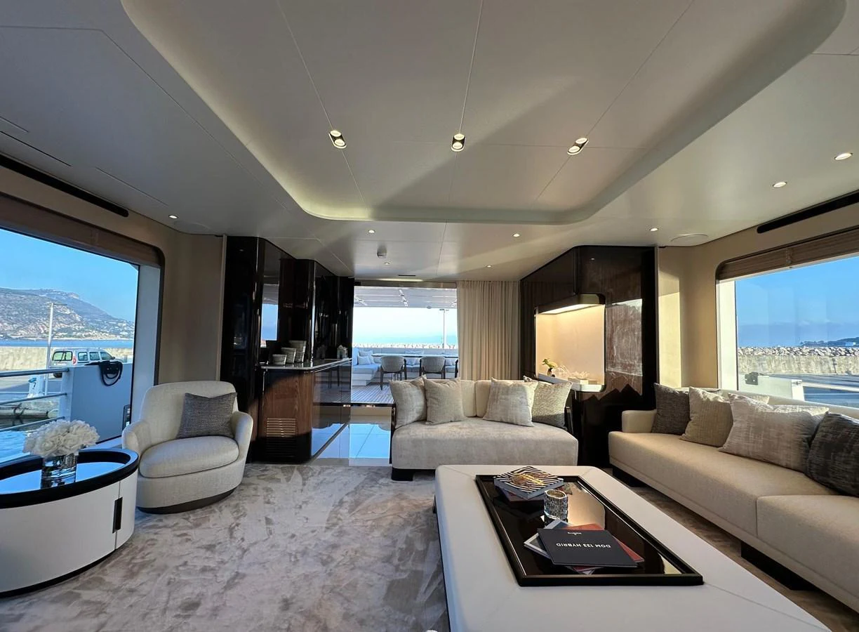 The salon features luxurious seating with panoramic views through large windows. aboard G Yacht for Sale