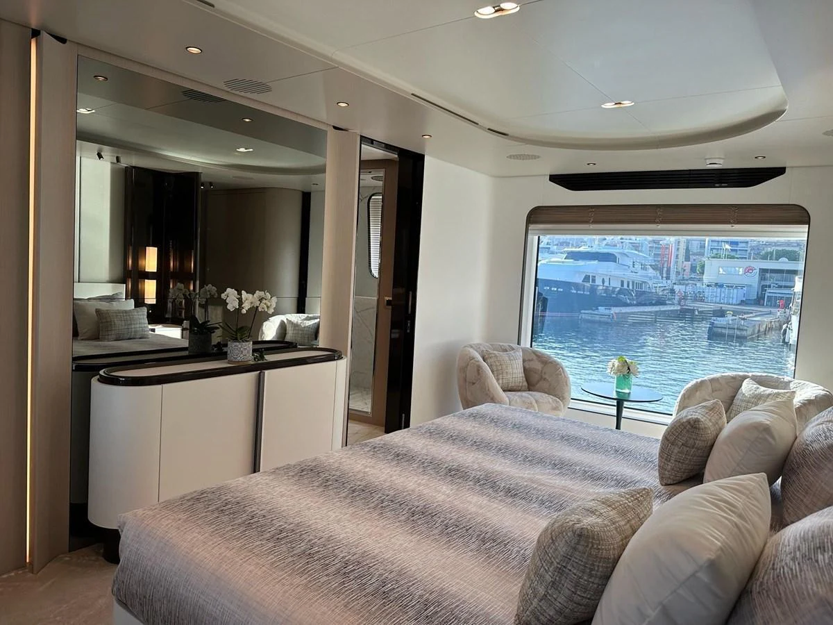 The master stateroom offers a luxurious and spacious retreat with a stunning view of the marina. aboard G Yacht for Sale