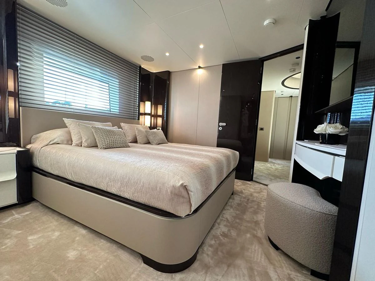 The stateroom features a plush bed with elegant bedding and modern decor, creating a serene and luxurious atmosphere. aboard G Yacht for Sale