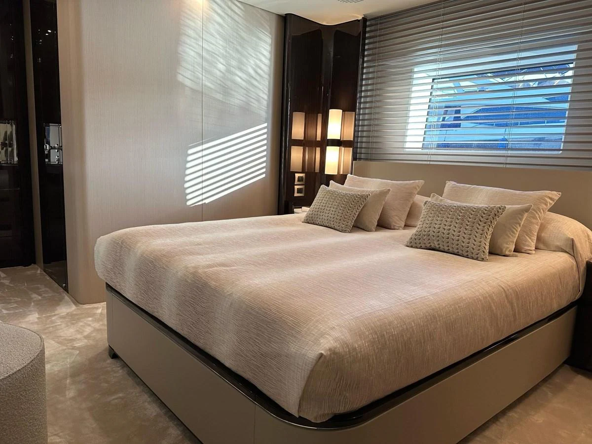 The stateroom features a plush bed with elegant bedding and soft lighting, creating a cozy and luxurious atmosphere. aboard G Yacht for Sale