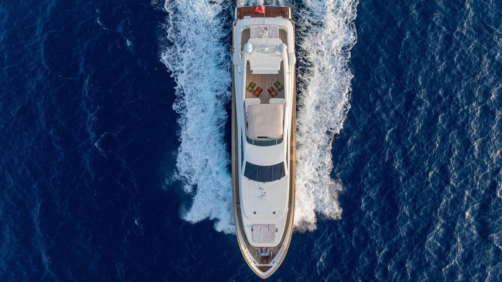 An aerial view of a luxurious yacht cruising through the open sea. aboard LIMION Yacht for Sale