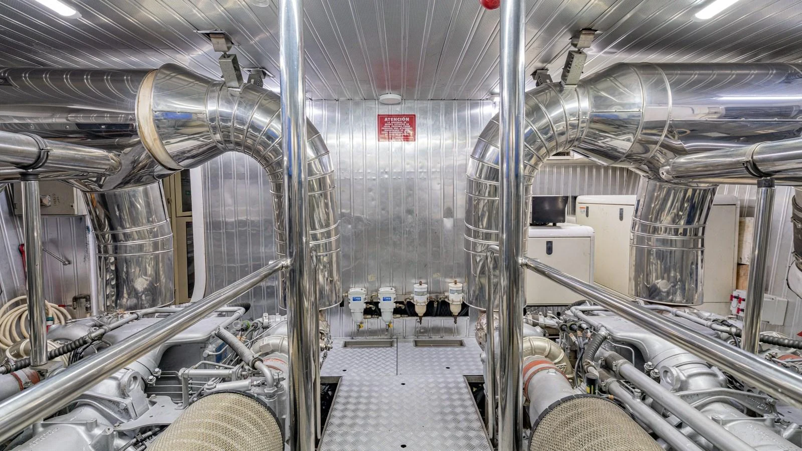 The image showcases the yacht's meticulously maintained engine room with polished metal surfaces and advanced machinery. aboard LIMION Yacht for Sale