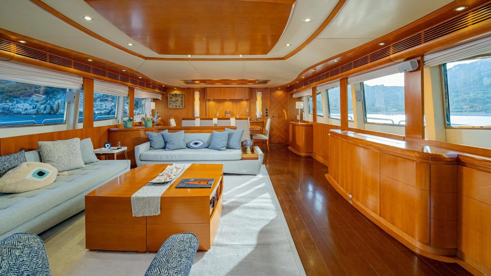The spacious salon features elegant wood finishes and ample natural light, creating a warm and inviting atmosphere. aboard LIMION Yacht for Sale