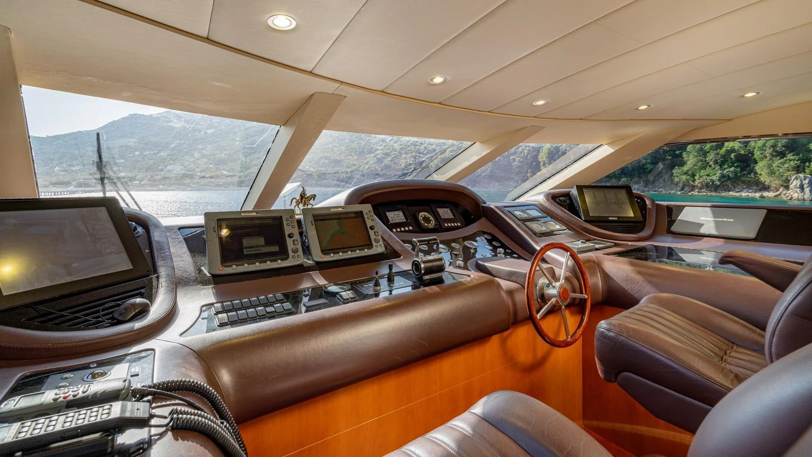 The helm station offers a commanding view with state-of-the-art navigation equipment and luxurious seating. aboard LIMION Yacht for Sale