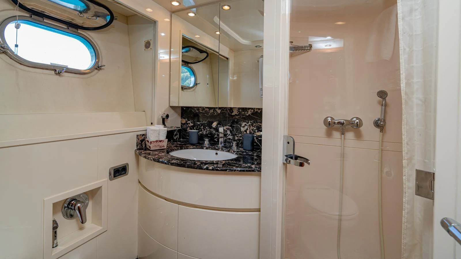 The yacht's bathroom features a sleek design with modern fixtures and a luxurious feel. aboard LIMION Yacht for Sale