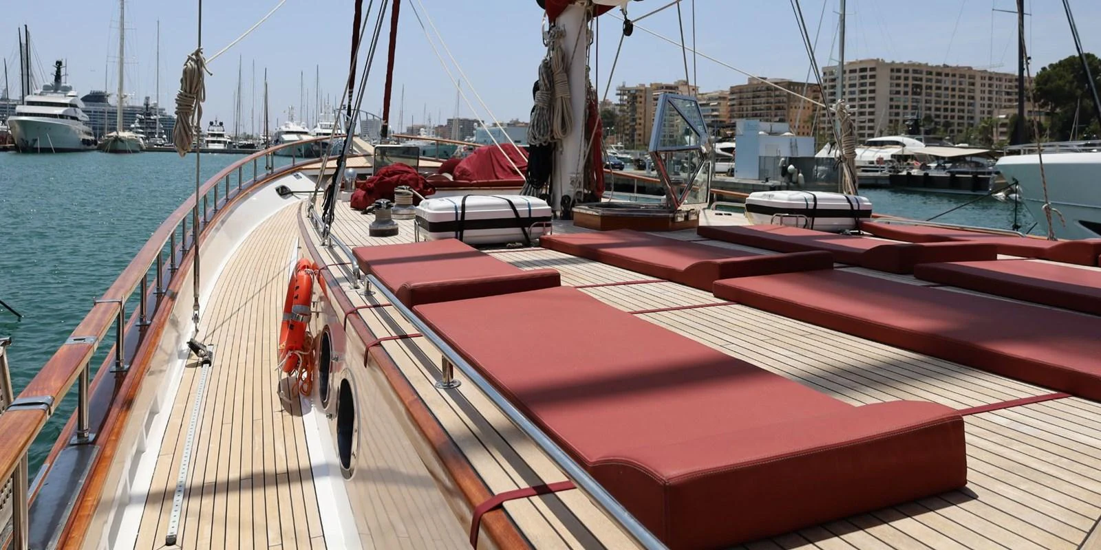 The yacht's deck features luxurious sun loungers and a spacious layout, perfect for relaxation. aboard AKHENATON Yacht for Sale