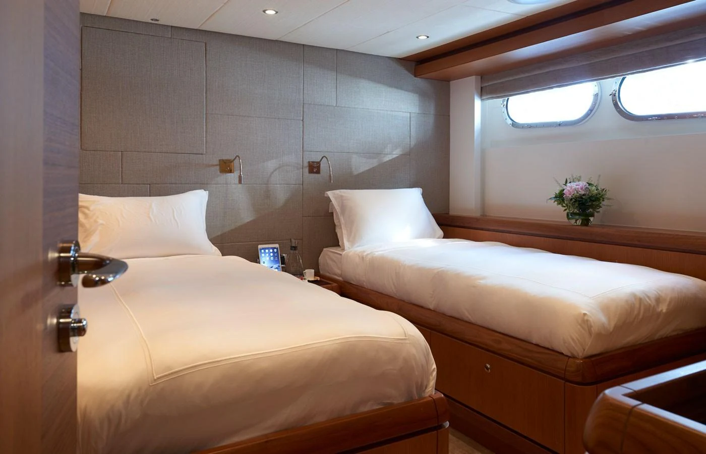 The twin stateroom offers a cozy and inviting space with two comfortable beds and soft lighting. aboard GALENA Yacht for Sale
