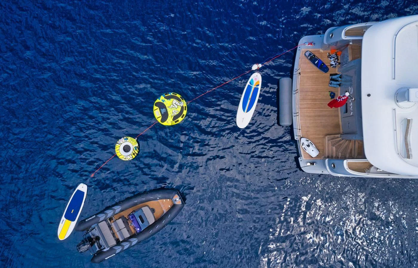 The yacht's aft deck is equipped with various water toys and a tender, perfect for aquatic adventures. aboard GALENA Yacht for Sale