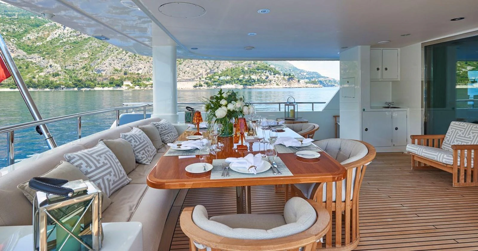 The aft deck offers an elegant dining area with stunning views of the surrounding waters. aboard GALENA Yacht for Sale