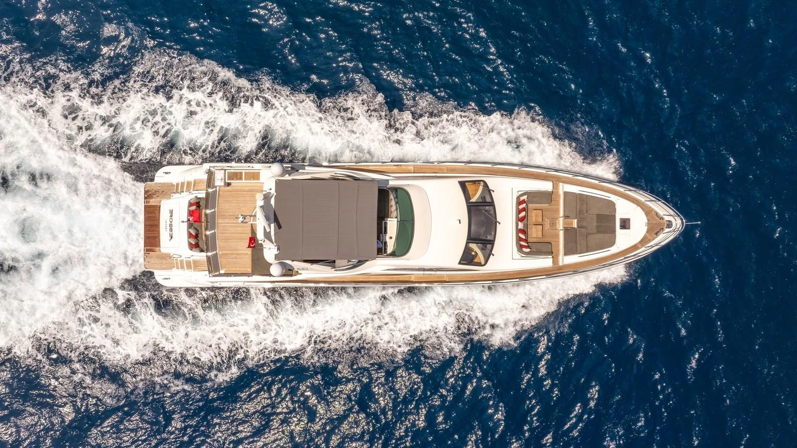 Aerial view of a luxurious yacht cruising through the open sea. aboard EROSSEA Yacht for Sale