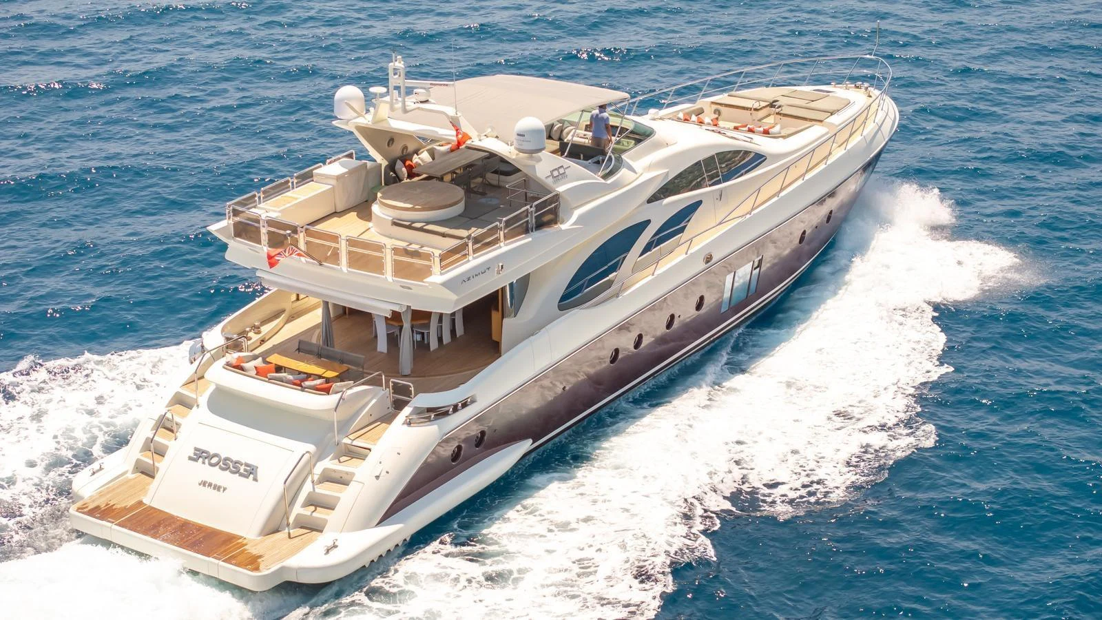 A luxurious yacht cruises through the open sea, showcasing its sleek design and spacious decks. aboard EROSSEA Yacht for Sale