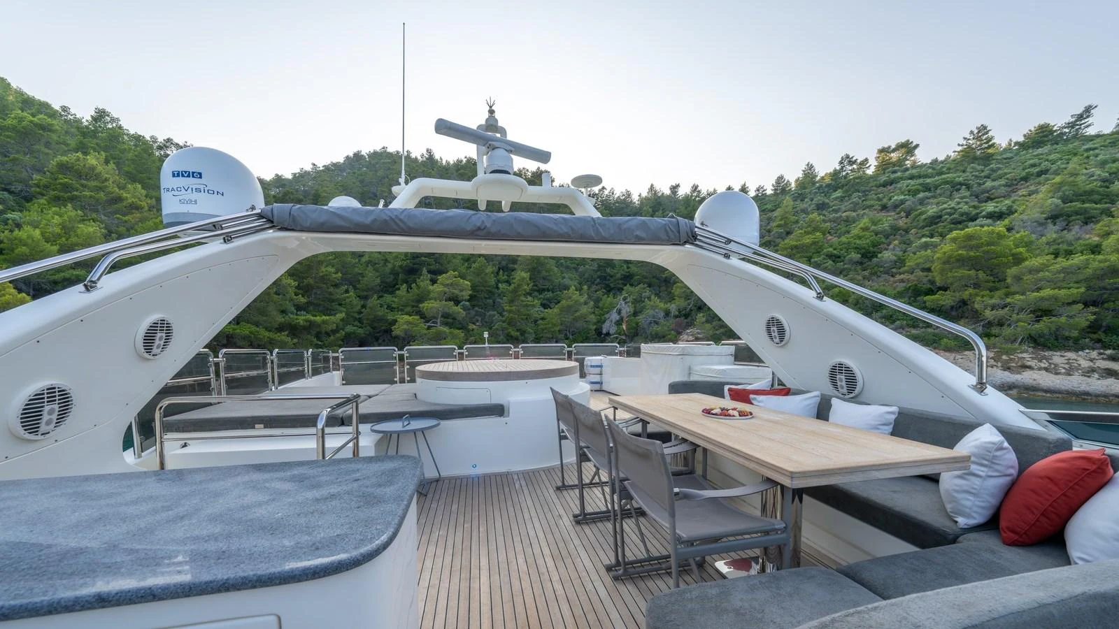 The yacht's aft deck features a spacious dining area with comfortable seating and scenic views. aboard EROSSEA Yacht for Sale