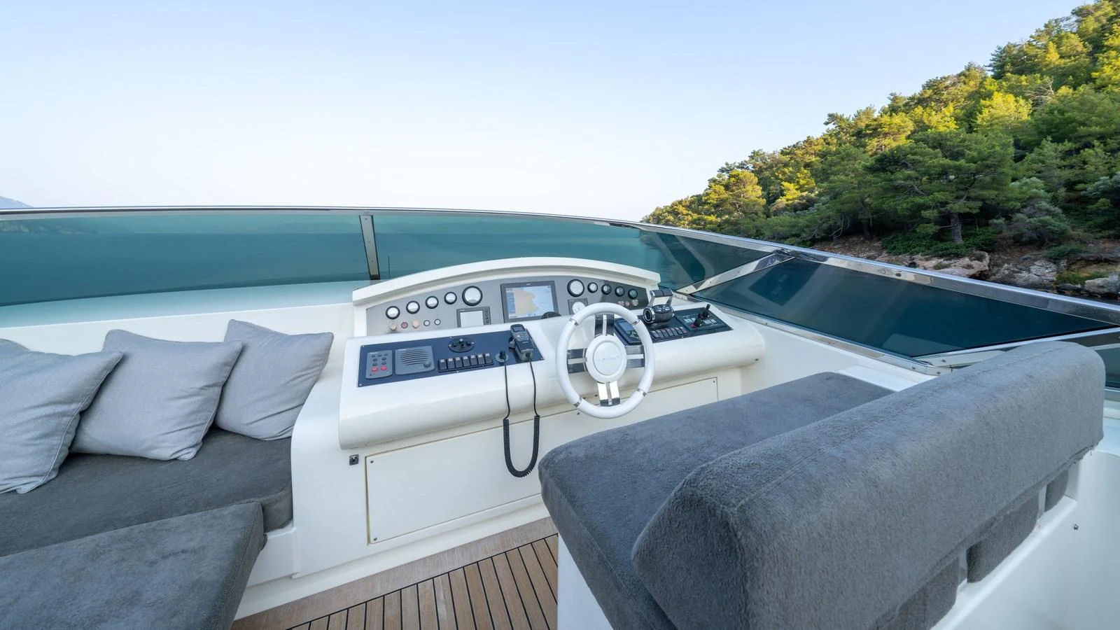 The helm station offers a modern and comfortable control area with a scenic view. aboard EROSSEA Yacht for Sale
