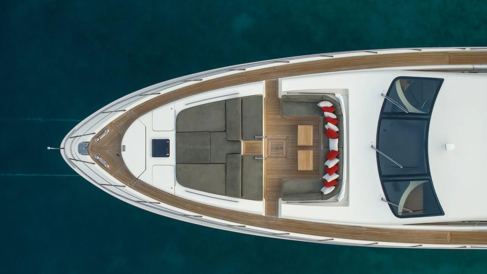 The foredeck features a spacious seating area with a central table, perfect for relaxation and socializing. aboard EROSSEA Yacht for Sale