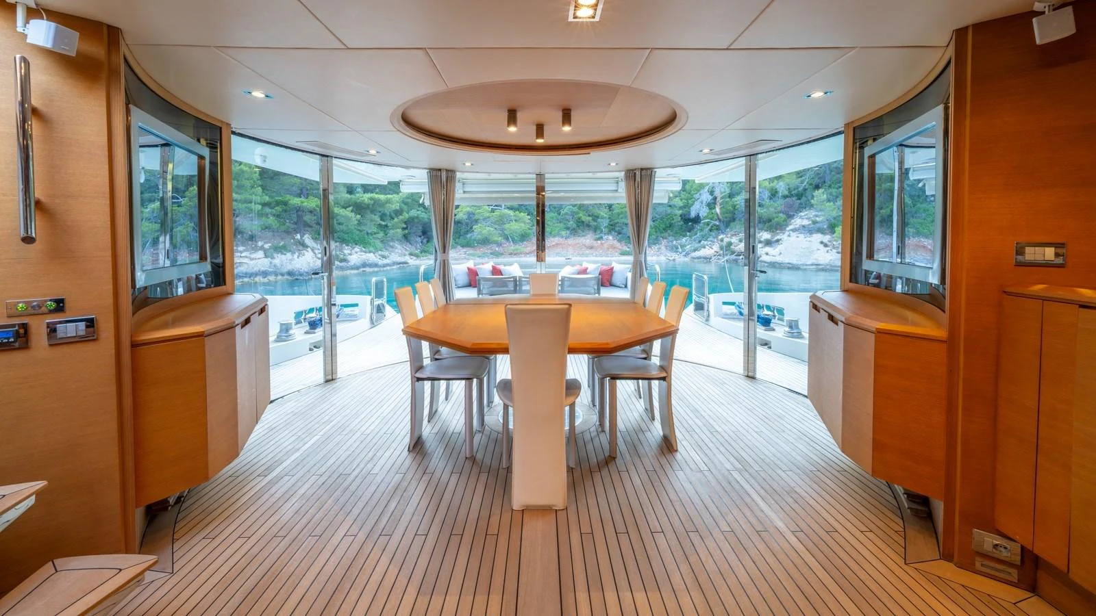 The yacht's dining area offers a spacious and elegant setting with panoramic views of the surrounding waters. aboard EROSSEA Yacht for Sale