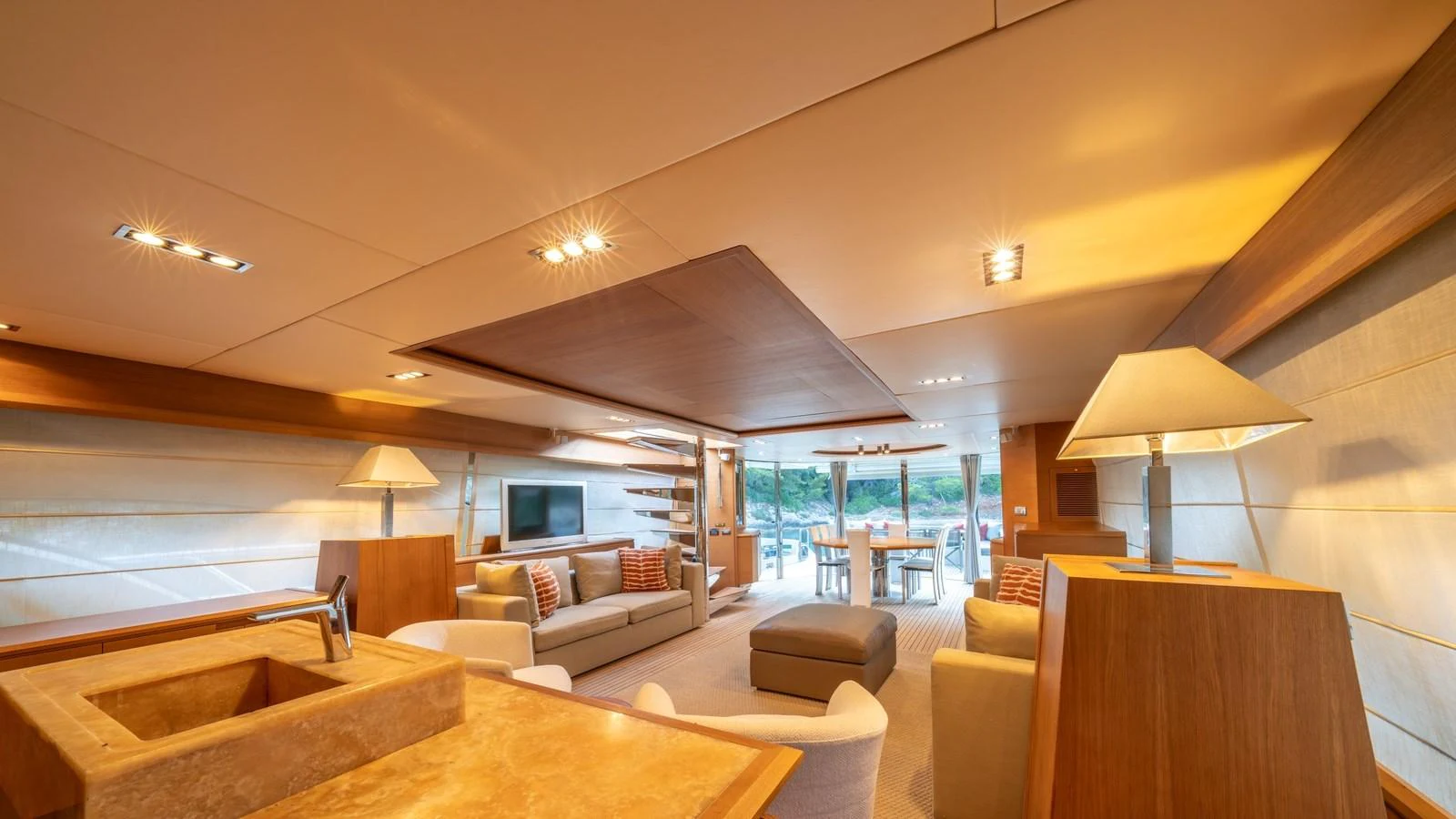 The yacht's salon features a spacious and elegantly designed living area with ample seating and natural light. aboard EROSSEA Yacht for Sale