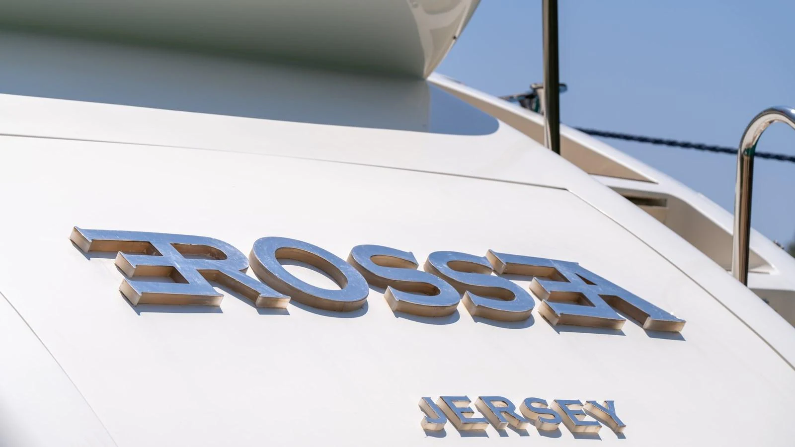 A close-up view of the yacht's nameplate and registration port on the stern. aboard EROSSEA Yacht for Sale