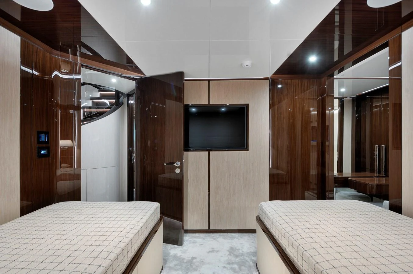 The guest stateroom features twin beds and a sleek, modern design with rich wood finishes. aboard LAZZARA UHV 90 Yacht for Sale