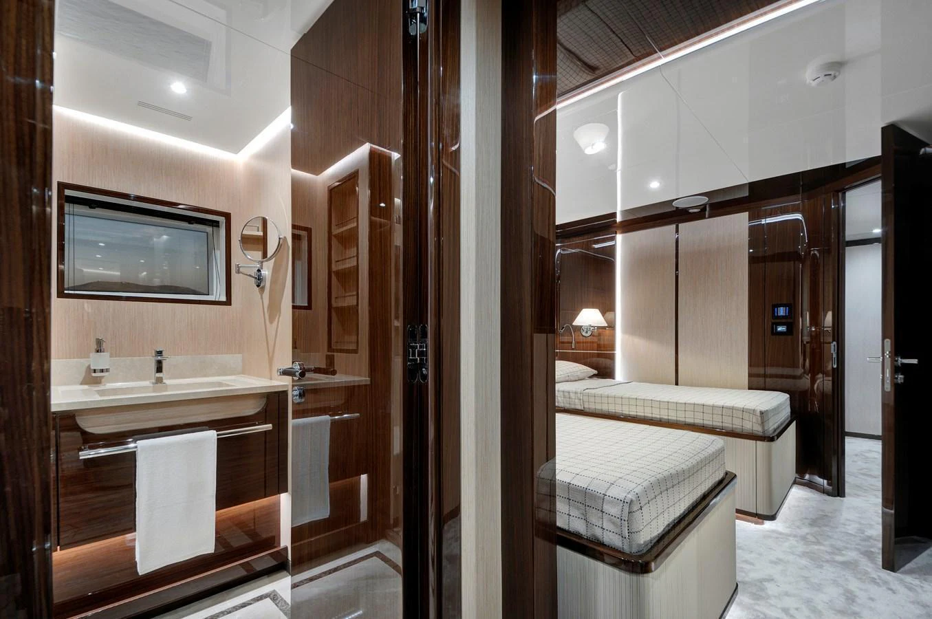 The image showcases a luxurious guest stateroom with modern design and elegant finishes. aboard LAZZARA UHV 90 Yacht for Sale