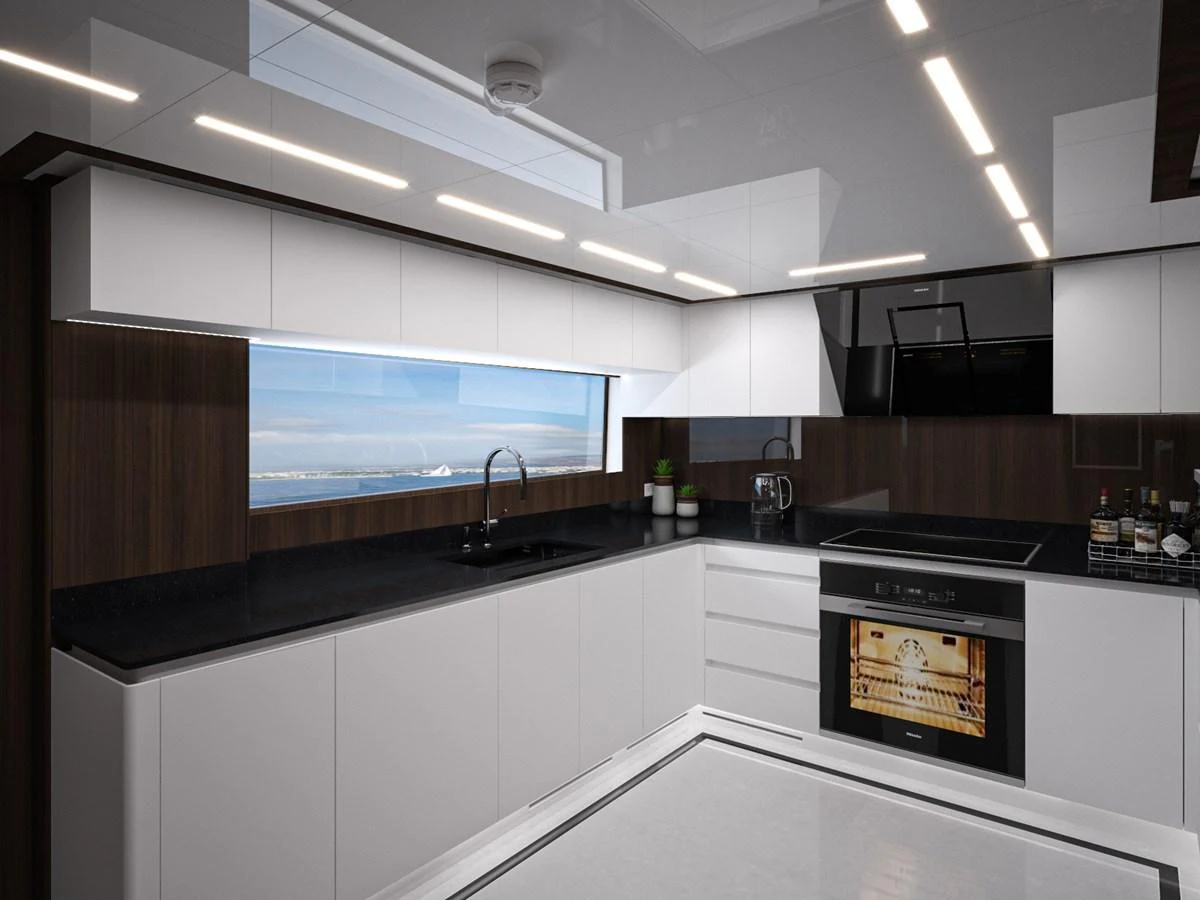 The modern galley features sleek cabinetry, high-end appliances, and a large window offering a stunning ocean view. aboard LAZZARA UHV 90 Yacht for Sale