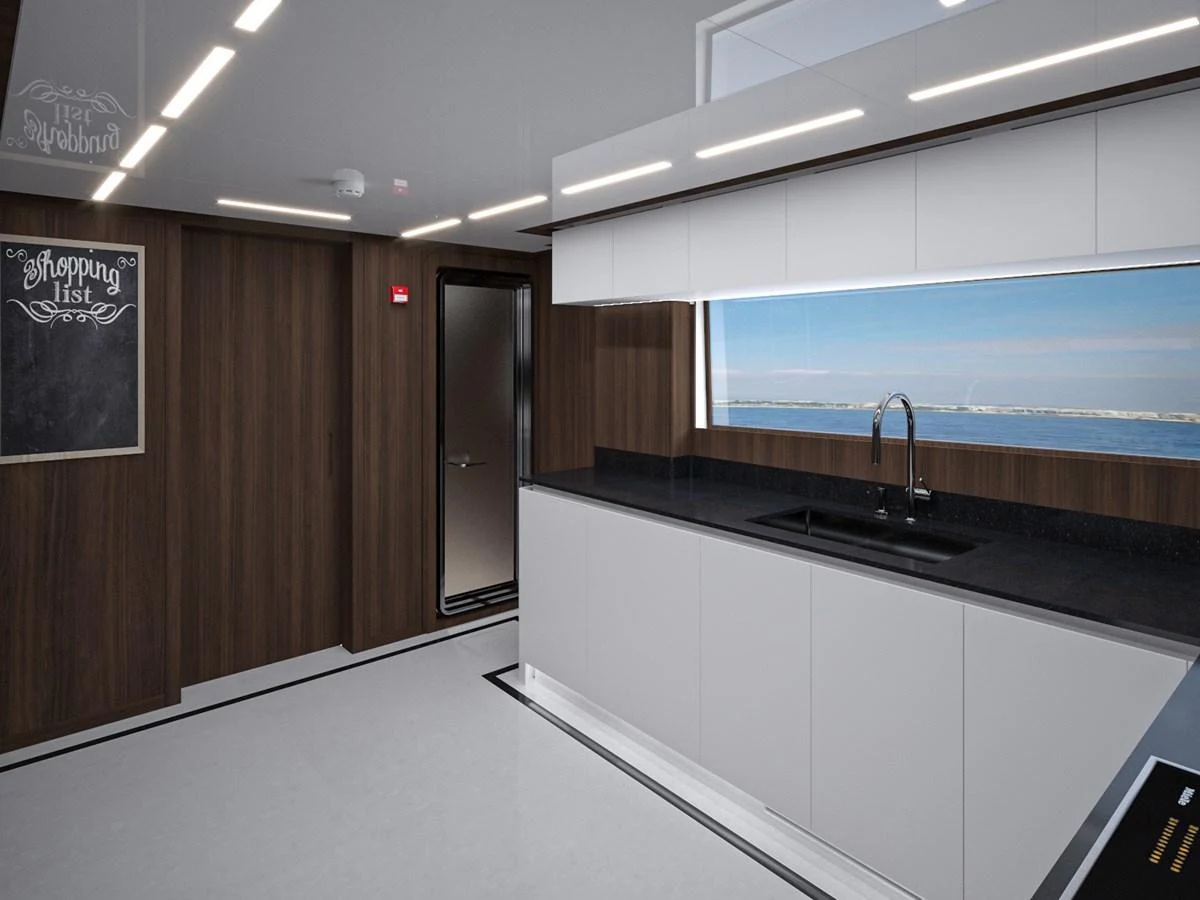 The sleek and modern galley features high-end finishes and a large window with a stunning ocean view. aboard LAZZARA UHV 90 Yacht for Sale