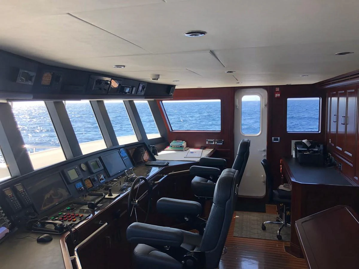 The helm station offers a commanding view with state-of-the-art navigation equipment and luxurious seating. aboard SAMSARA Yacht for Sale