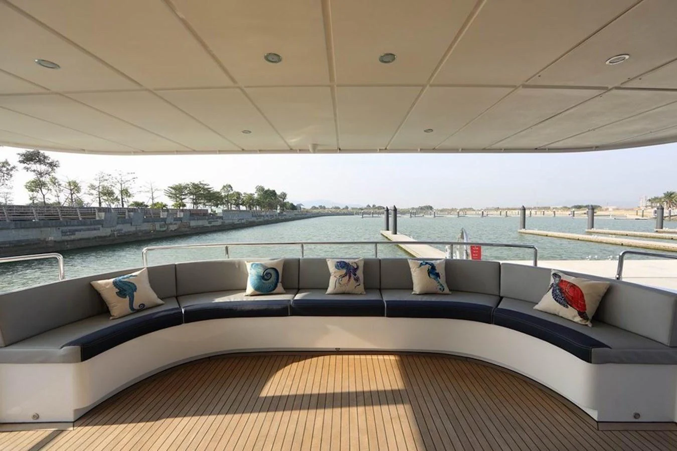 The aft deck features a spacious and comfortable seating area with a scenic view of the water. aboard SAMSARA Yacht for Sale