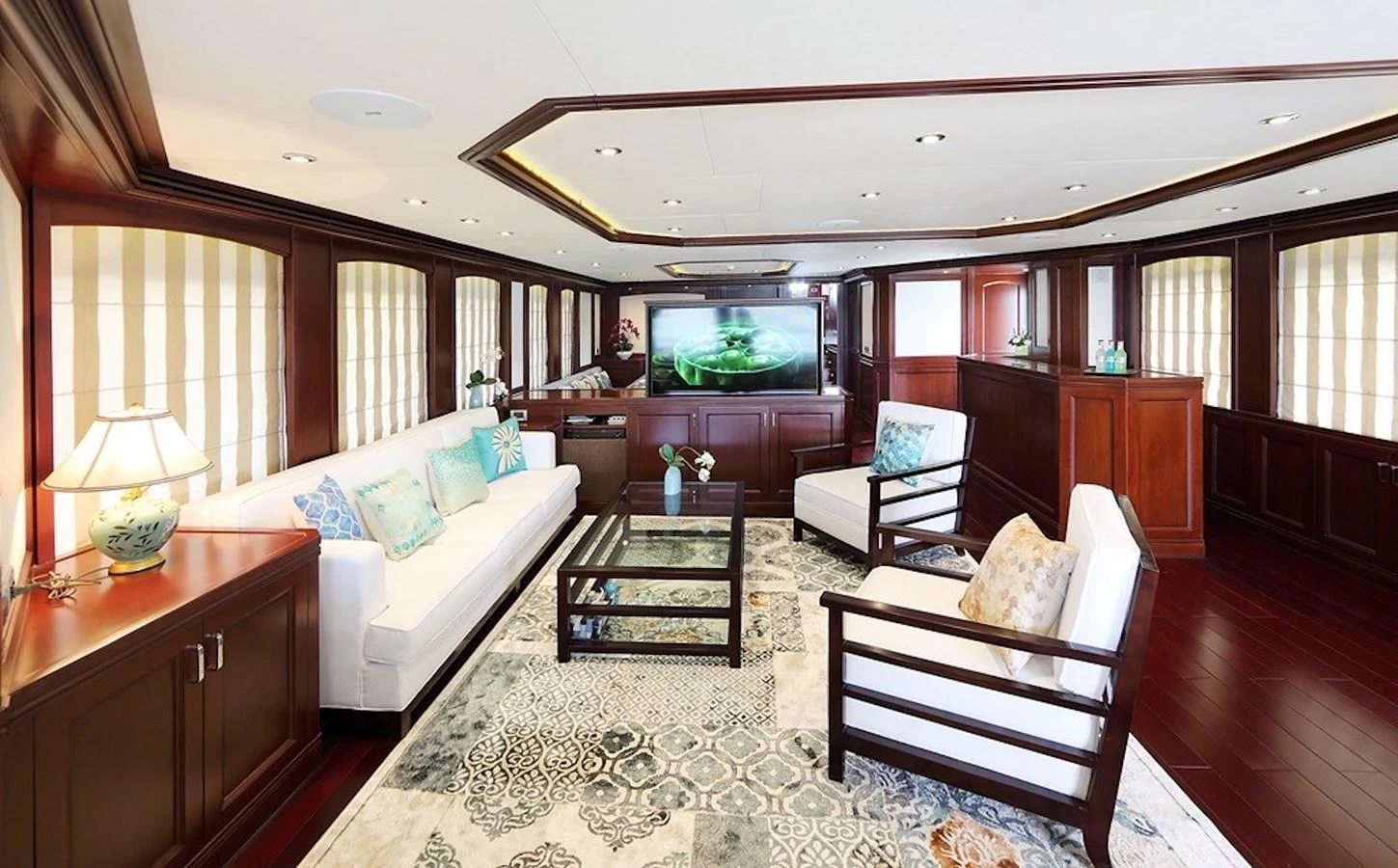 The yacht's salon features elegant furnishings with a blend of modern and classic design elements. aboard SAMSARA Yacht for Sale