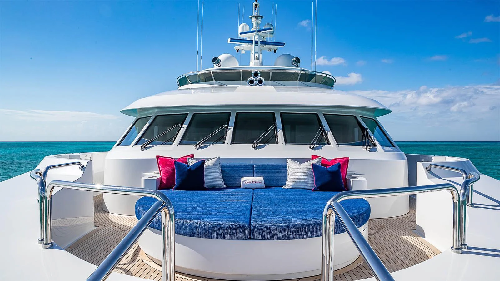 The foredeck features a luxurious seating area with plush cushions, perfect for relaxation while enjoying the ocean view. aboard CARTE BLANCHE Yacht for Sale