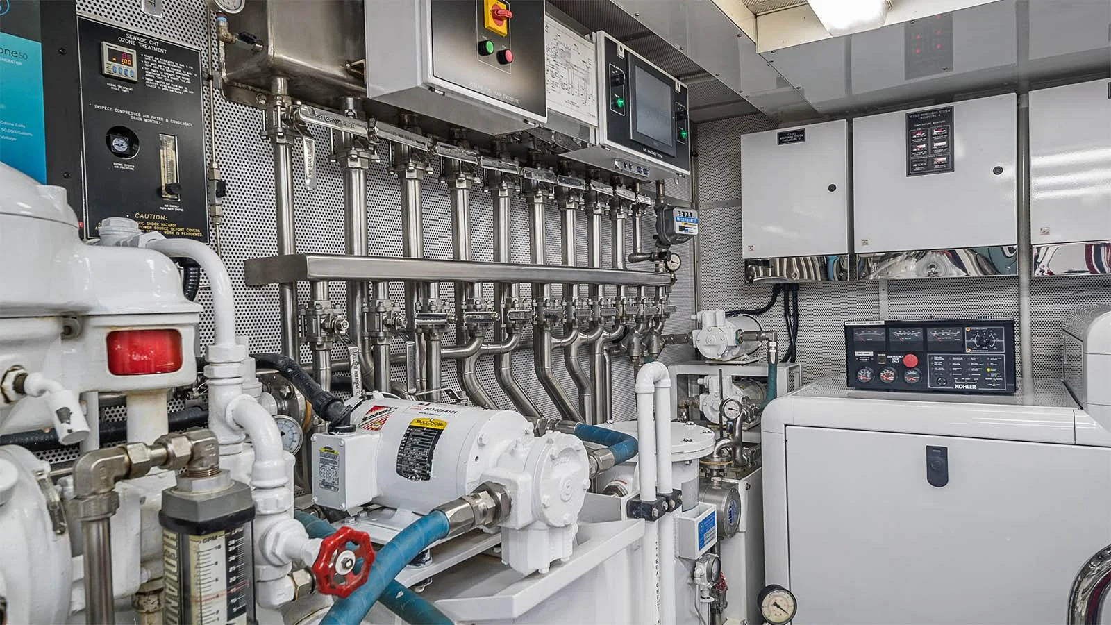 The engine room showcases advanced machinery and control systems for optimal yacht performance. aboard CARTE BLANCHE Yacht for Sale