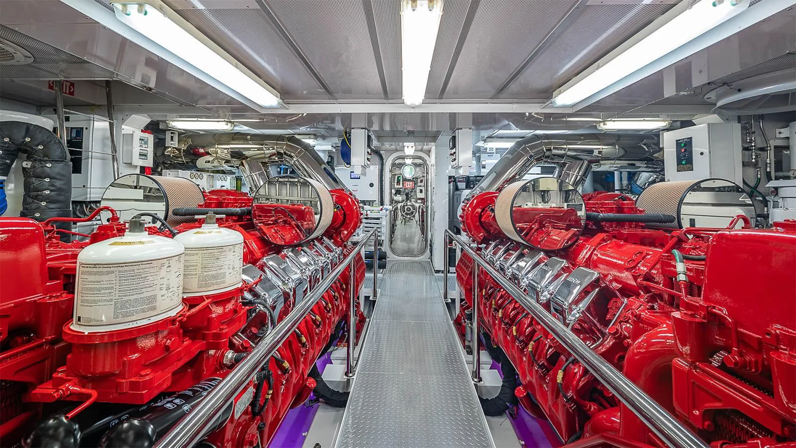 The engine room showcases powerful, meticulously maintained machinery. aboard CARTE BLANCHE Yacht for Sale
