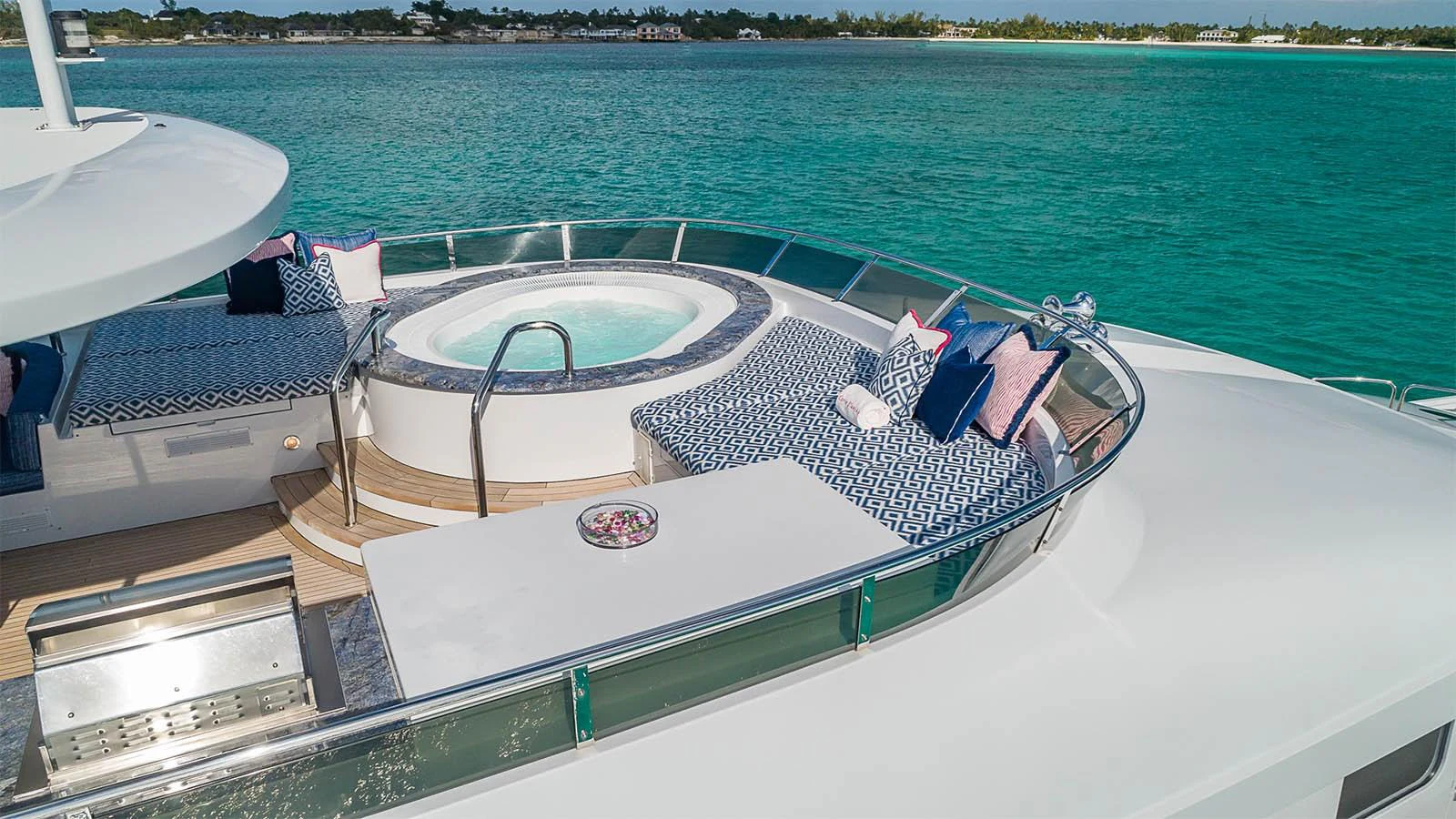 The foredeck features a luxurious jacuzzi surrounded by plush sun pads, offering a perfect spot for relaxation with stunning ocean views. aboard CARTE BLANCHE Yacht for Sale