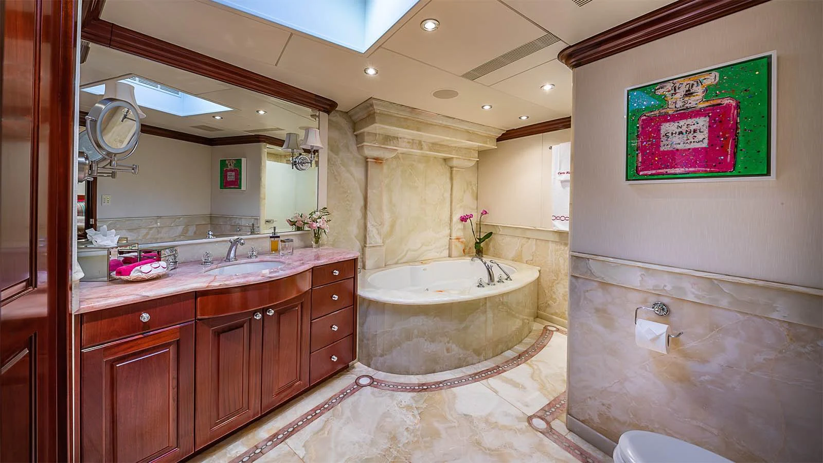 The luxurious bathroom features elegant marble finishes and a spacious bathtub. aboard CARTE BLANCHE Yacht for Sale