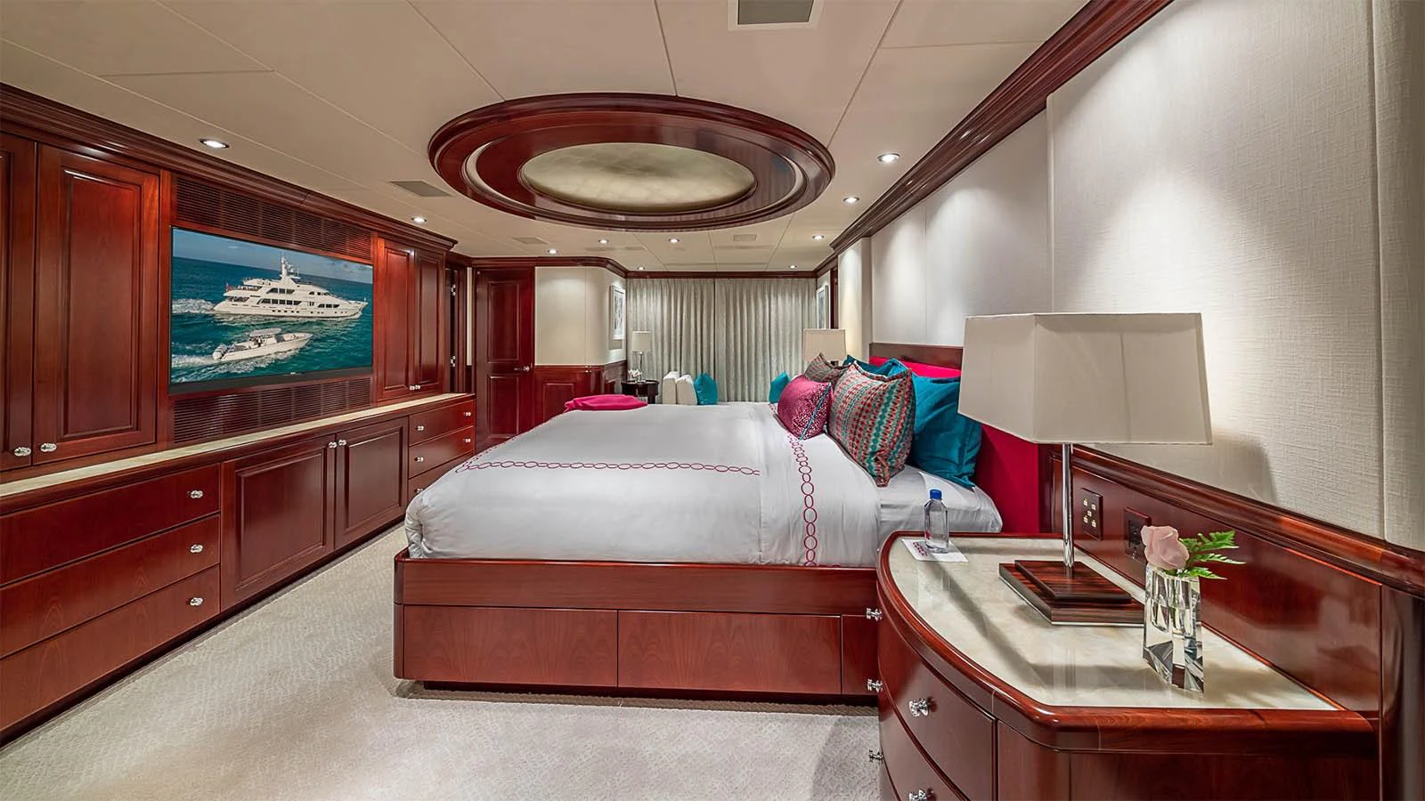 The master stateroom features luxurious wood paneling and elegant bedding, creating a serene and opulent retreat. aboard CARTE BLANCHE Yacht for Sale