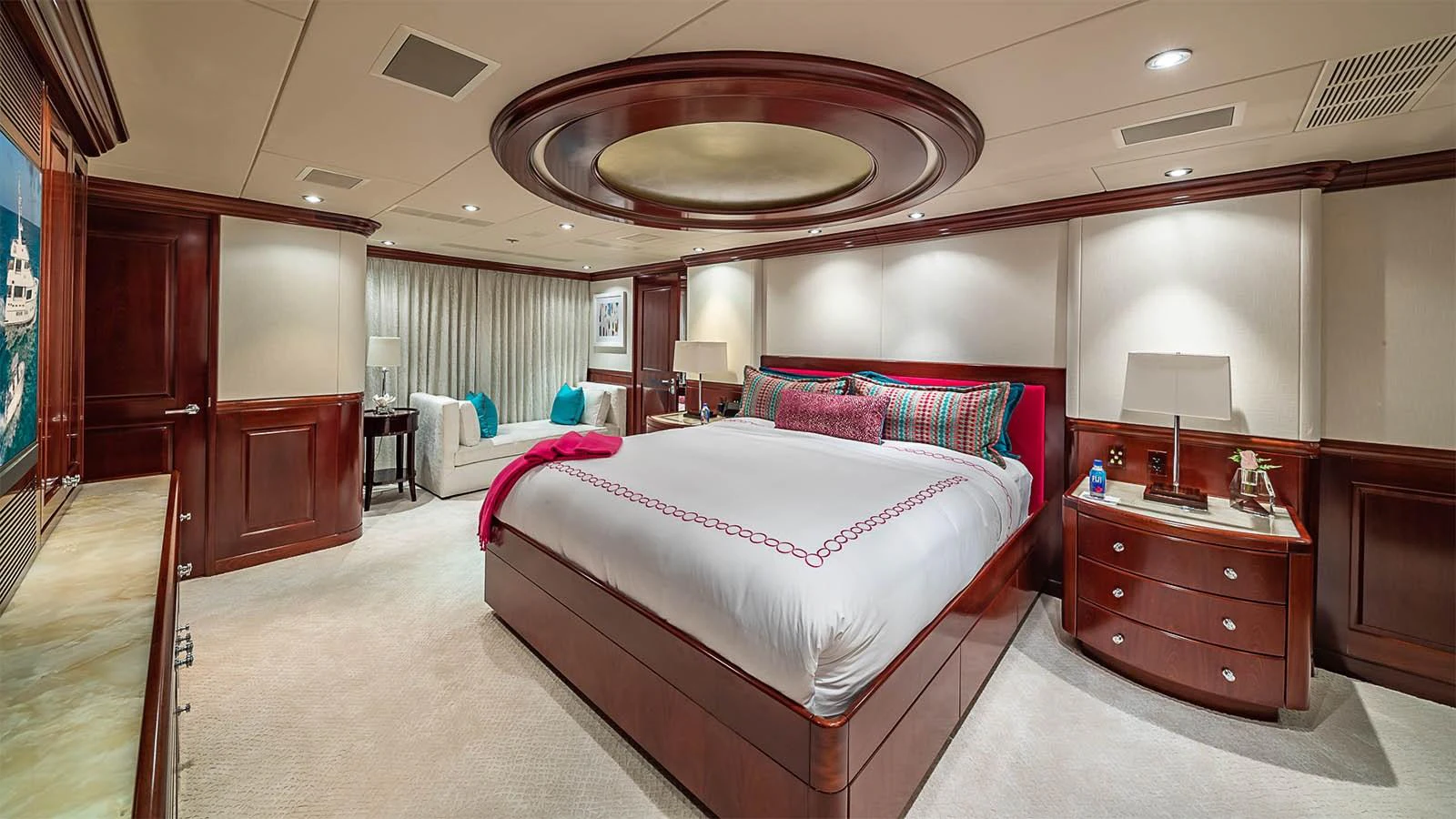 The master stateroom features a luxurious king-size bed with elegant wood paneling and ambient lighting. aboard CARTE BLANCHE Yacht for Sale