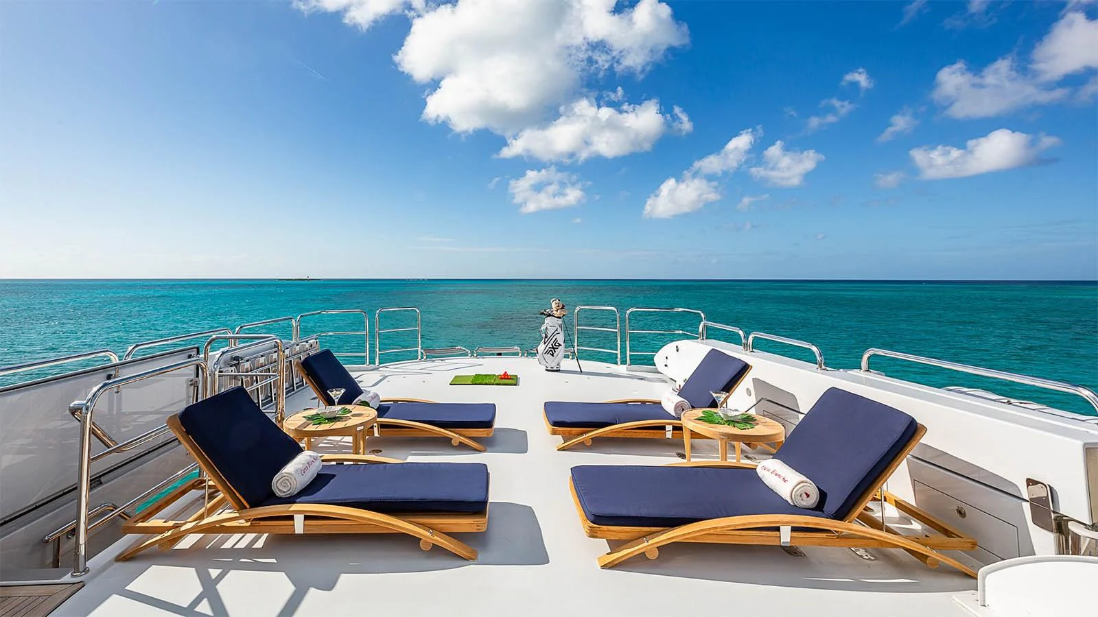 The sundeck offers a serene space with luxurious loungers and stunning ocean views. aboard CARTE BLANCHE Yacht for Sale
