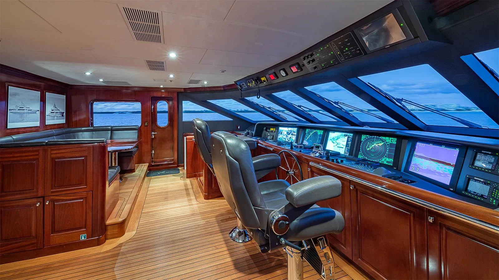 The helm station features state-of-the-art navigation equipment and luxurious seating, offering a commanding view of the surroundings. aboard CARTE BLANCHE Yacht for Sale