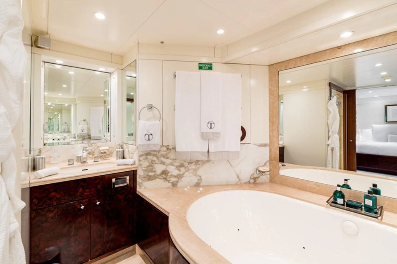 The yacht's bathroom features luxurious marble accents and a spacious bathtub. aboard LA TANIA Yacht for Sale