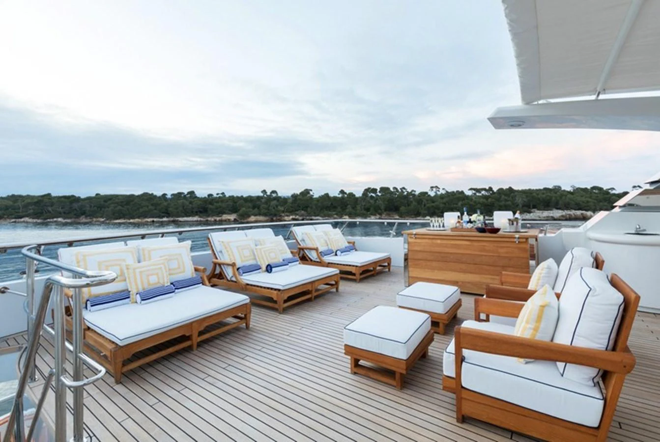The sundeck offers luxurious lounging with plush seating and scenic views. aboard LA TANIA Yacht for Sale