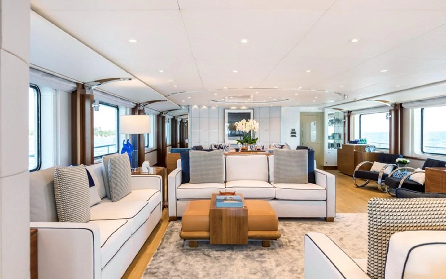 The salon features elegant seating with a contemporary design and ample natural light. aboard LA TANIA Yacht for Sale