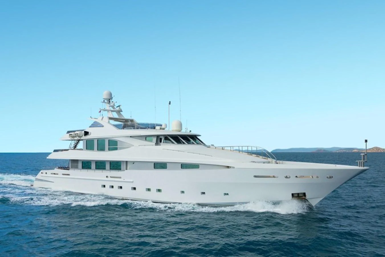 A sleek and modern yacht cruises through the open water under a clear blue sky. aboard LA TANIA Yacht for Sale